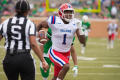 Primary view of [LA Tech player running the ball]