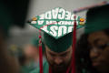 Photograph: [Mayborn Bachelor's Graduate showing off cap]