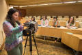 Photograph: [Andrea Czobor showing students how to work camera]