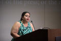 Photograph: [Woman speaking from podium at "First Amendment: Under Siege?" panel]