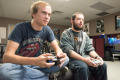 Photograph: [Two students playing video games]