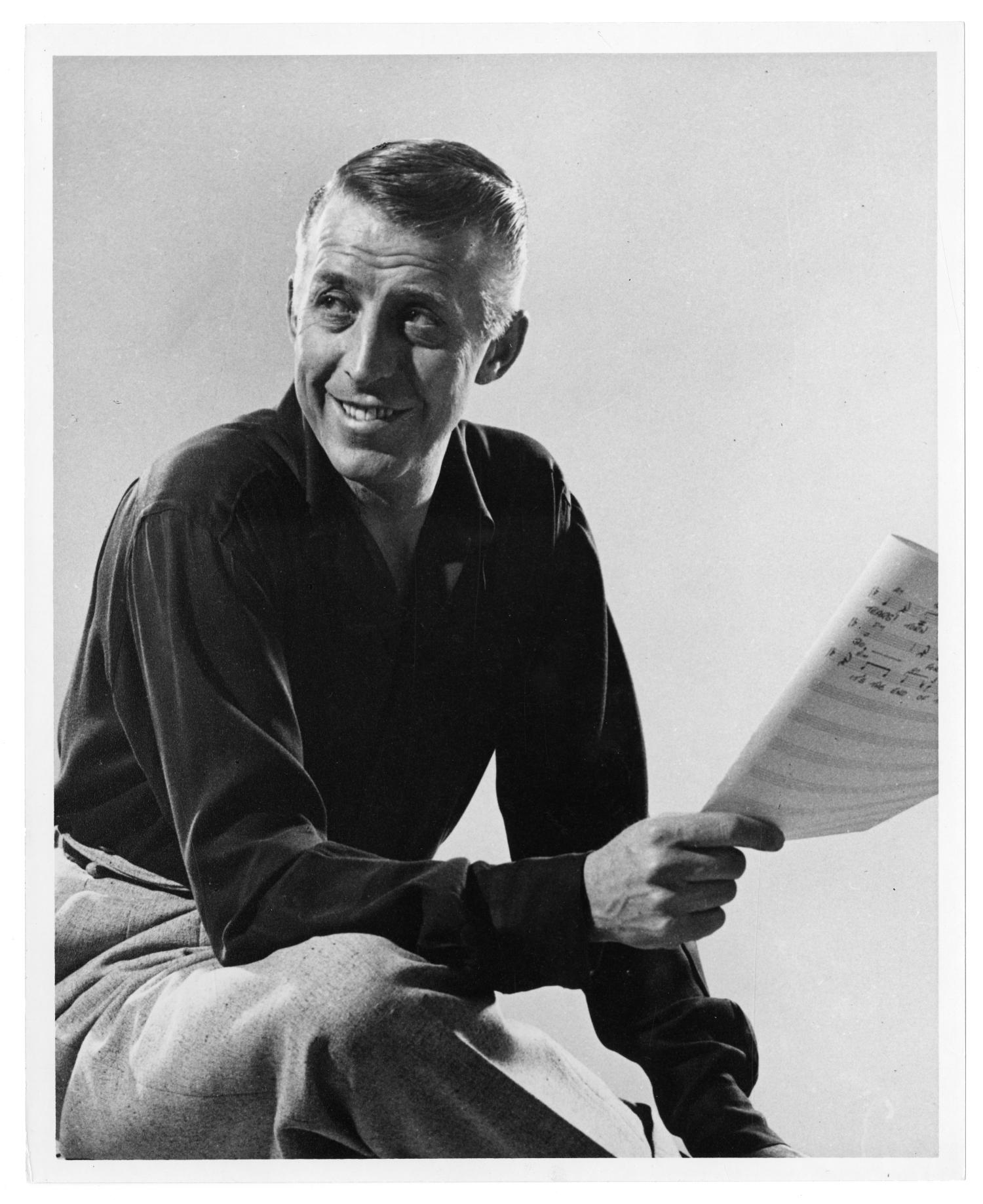 [Photograph of Stan Kenton with a Score]
                                                
                                                    [Sequence #]: 1 of 2
                                                