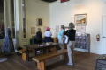 Photograph: [Attendees touring Oregon Trail exhibit]