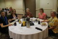 Photograph: [Attendees gathered at table for breakfast]