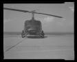 Photograph: [Photograph of a front view of a UH-1B Iroquois helicopter armed with…
