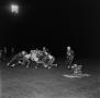 Photograph: [Parsons players tackling opponents]