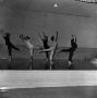 Photograph: [Dancers reaching to the ceiling, 2[]
