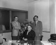 Photograph: [James Byron, Doyle, and Jim Vinson in an office]