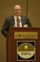 Photograph: [Bob Carlquist speaking at the TDNA conference in Corpus Christi]