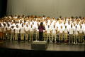 Primary view of [Choir members singing on stage together]