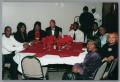 Primary view of [Guest goers attending Christmas Kwanzaa soiree]