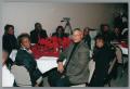 Primary view of [Guests attending Christmas Kwanzaa soiree]