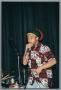 Photograph: [Photograph a man rapping into a microphone]