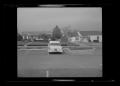 Photograph: [A car parked in a parking lot in a neighborhood]