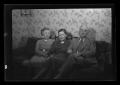 Photograph: [A family sitting on a couch]