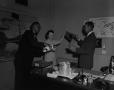 Photograph: [Hal Thompson and his secretary sharing a drink 4 of 4]