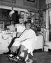 Photograph: [Bobby Peters at barber shop]