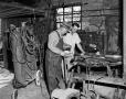 Photograph: [Photograph of two men at Blacksmith Shop]