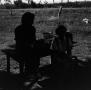 Photograph: [Photograph of two women sitting at a table outside]
