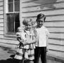 Primary view of [Photograph of Tim and Carol Williams posing with a doll]