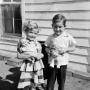 Primary view of [Photograph of Carol and Tim Williams posing with dolls]