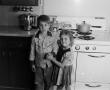 Photograph: [Photograph of Byrd IV and Pam Williams posing in a kitchen, 2]