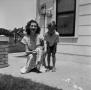 Photograph: [Photograph of Doris Stiles Williams and Tim Williams posing outside]