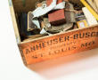 Photograph: [Family artifacts in an Anheuser-Busch crate]