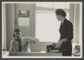 Photograph: [Two people at an office]
