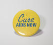 Photograph: ["Cure AIDS Now" button]