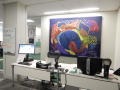 Photograph: [Front desk and mural in MC office 3]
