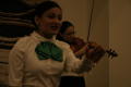 Photograph: [Mariachi singer and violinist at 2004 La Raza ceremony]