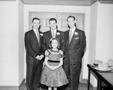Photograph: [Photograph of three men and a girl]