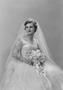 Photograph: [Portrait of Jane Williams in a wedding dress, holding a bouquet, 3]