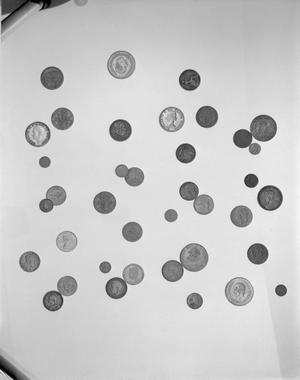 Primary view of object titled '[Photograph of coins from various nationalities]'.
