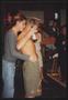 Photograph: [An individual kissing the back of a shirtless mans neck: Lone Star R…