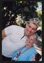 Photograph: [Cyclist in a tiara and Janie Bush embracing: Lone Star Ride 2005 eve…