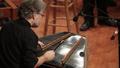 Primary view of [Musician playing a hammered dulcimer at the Percussion Holiday Performance]