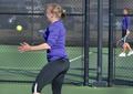 Photograph: [TCU player hits forehand during UNT match]