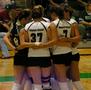 Photograph: [UNT volleyball team huddles on the court]