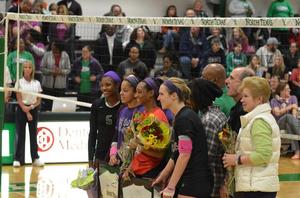 Primary view of object titled '[UNT volleyball players and coaches pose with flowers, 2]'.