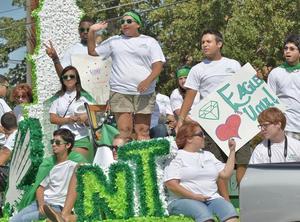 Primary view of object titled '[Emerald Eagle float at 2011 Homecoming Parade, 1]'.