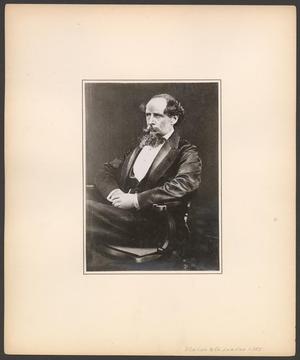 Primary view of object titled '[Charles Dickens sitting in a chair with his hands in his lap]'.