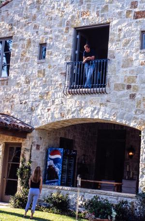 Primary view of object titled '[Mike Modano standing on a balcony, 5]'.