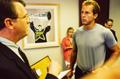 Photograph: [Mike Modano in an office with three others]