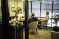 Photograph: [Mike Modano sitting in a glass walled office with two other men, 2]