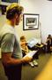 Photograph: [Mike Modano in an office with Boy Scouts]