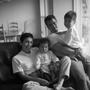 Photograph: [Fred, Diana and their two sons on a couch]