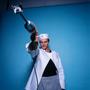 Photograph: [Chef Enrique Granados posing with an immersion blender]
