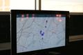 Photograph: [A monitor showing blue-purple spots on a map of Manhattan, NY]